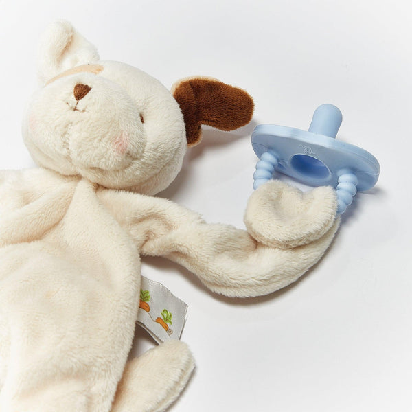 Close up view of Skipit Silly Buddy holding pacifier