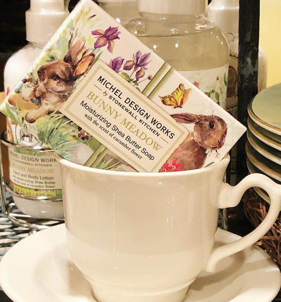 Soap bar with rabbit design in a teacup on a saucer