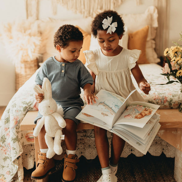 Children reading w/ Bun Bun Bunny Stuffed Animal