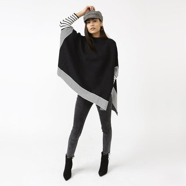 Eddie Stripe Poncho shown on model in Skinny Jeans & boots