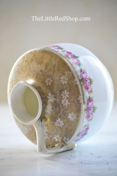 Detail view of Embossed floral Gold Design on Jug