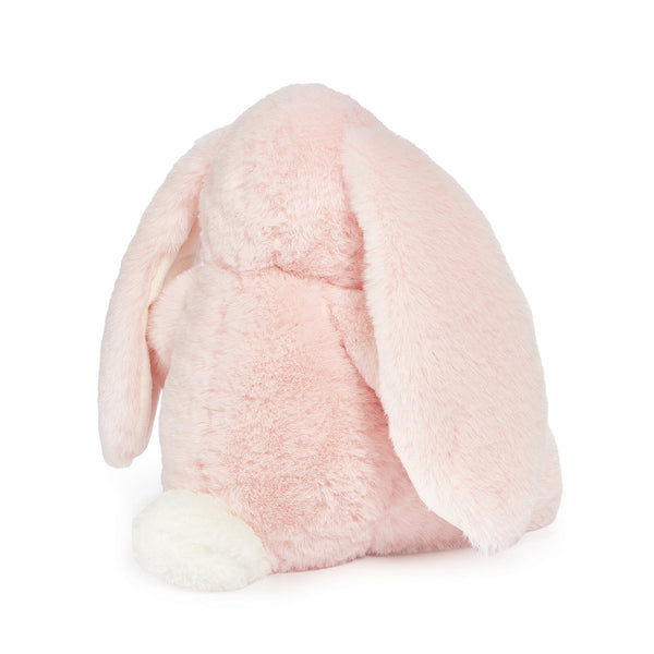 Back view of pink stuffed bunny w/ white tail