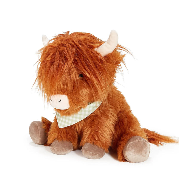 Plush toy Highland cow with a checkered scarf on a white background