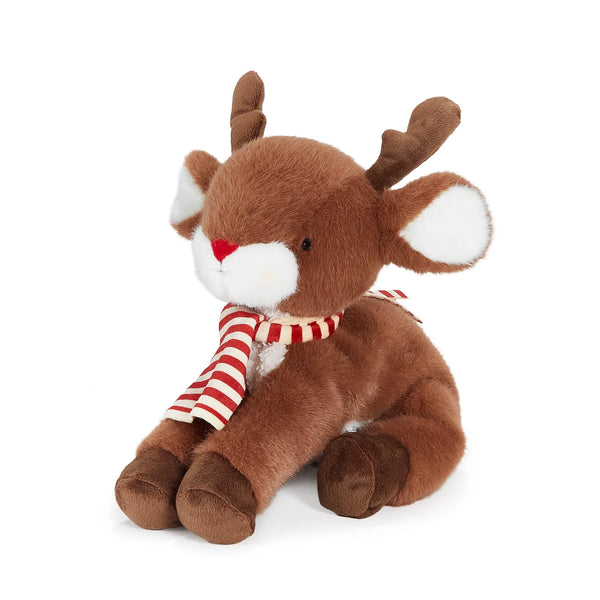 Side view of plush reindeer toy with a red and cream striped scarf on a white background