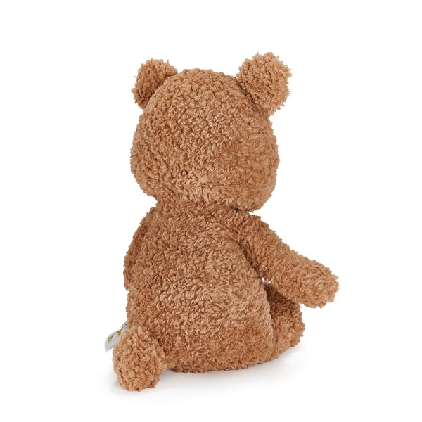 Back view of Brown teddy bear sitting on a white background