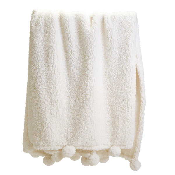 Two's Company Cream Pom Pom Sherpa Blanket shown folded
