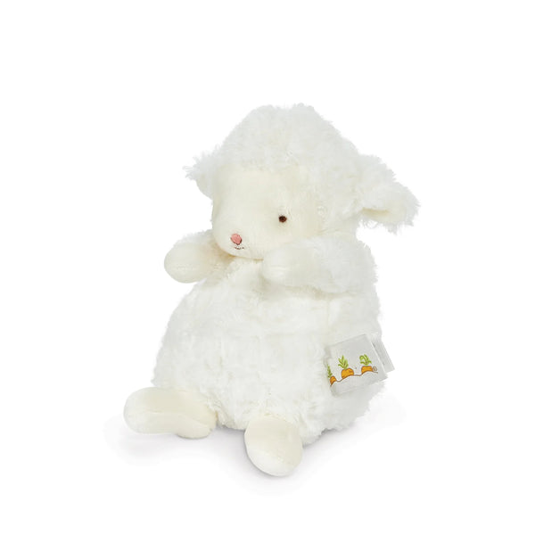 White plush lamb toy with a carrot tag on a white background