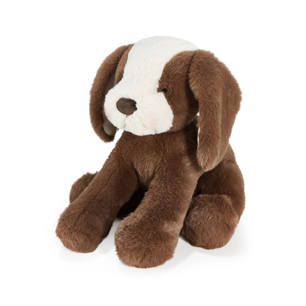 Brown and cream plush dog toy on a white background