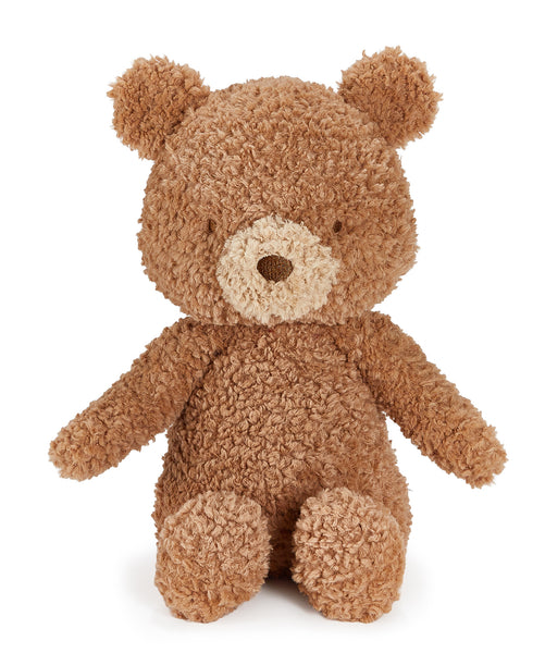 A plush teddy bear toy made of curly, bouclé-like brown fabric, with a cream-colored snout and nose, photographed against a plain white background.
