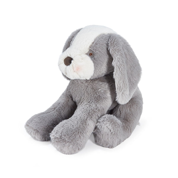 Gray plush puppy toy on a white background
