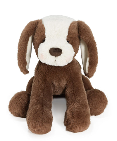 Brown and cream plush dog toy on a white background