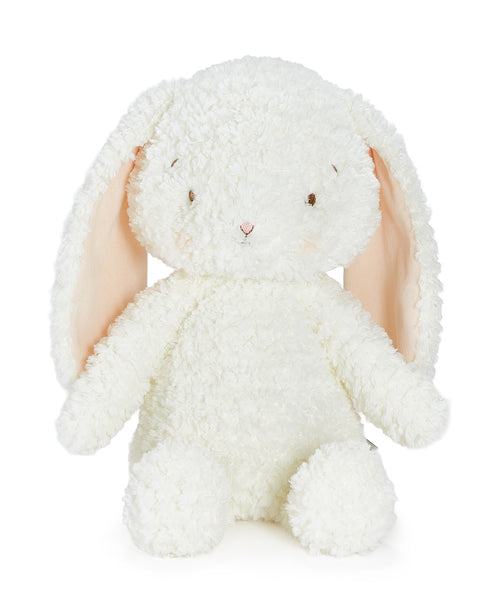 A fluffy white plush bunny with long peach-pink inner ears, small embroidered eyes, and a tiny pink nose, photographed on a clean white background.