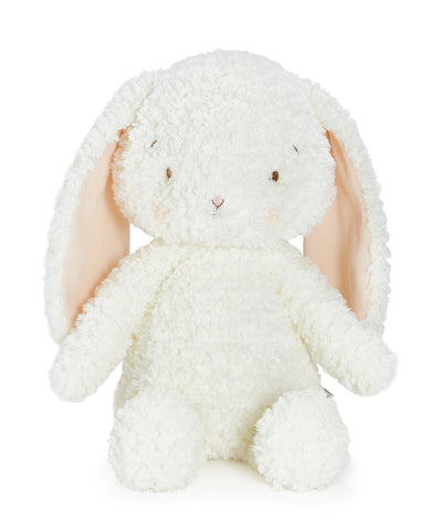 A fluffy white plush bunny with long peach-pink inner ears, small embroidered eyes, and a tiny pink nose, photographed on a clean white background.