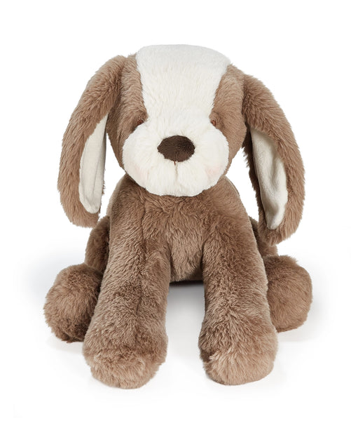 Brown and cream plush dog toy on a white background