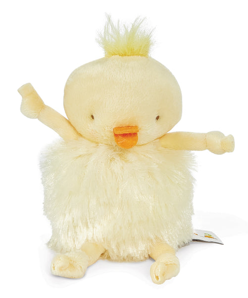A soft plush toy chick with a fluffy cream-colored body, a small orange beak, and a tuft of yellow hair on its head, set against a plain white background.