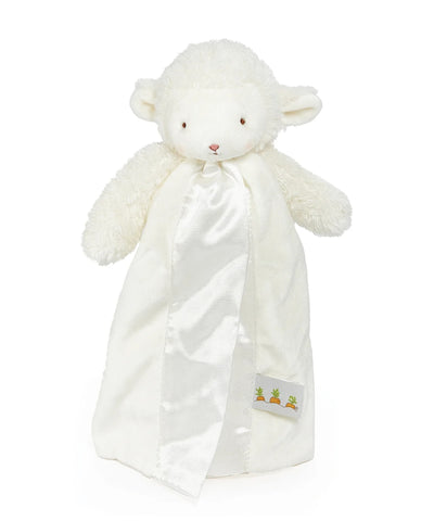 White plush lamb toy with a blanket on a white background