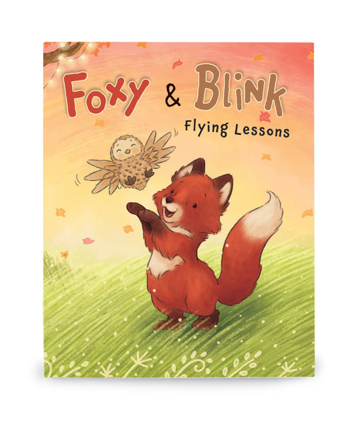 Book cover of 'Foxy & Blink Flying Lessons' with a fox and owl illustration on a colorful background.