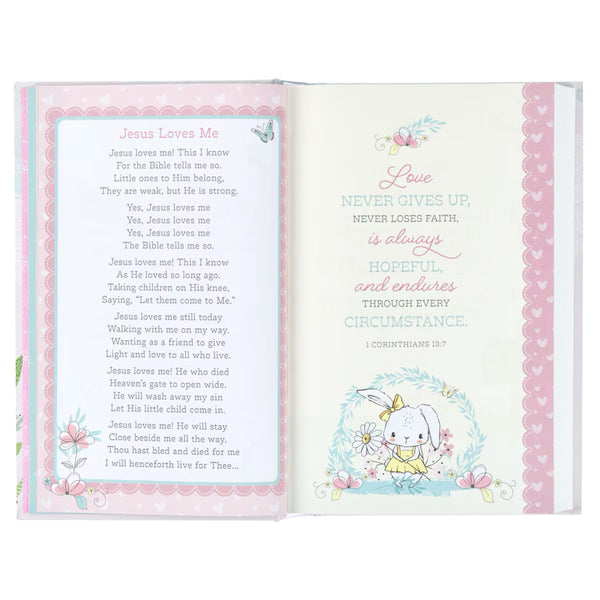 Open Bible with Jesus Loves Me lyrics, 1 Corinthians 13:7 and illustration of a Bunny, Butterfly. and flowers