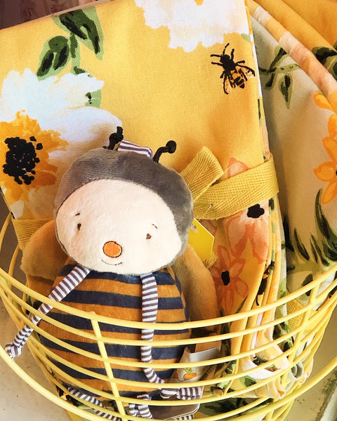 Toy bee in a yellow basket with floral and bee Kitchen Towel Sets.