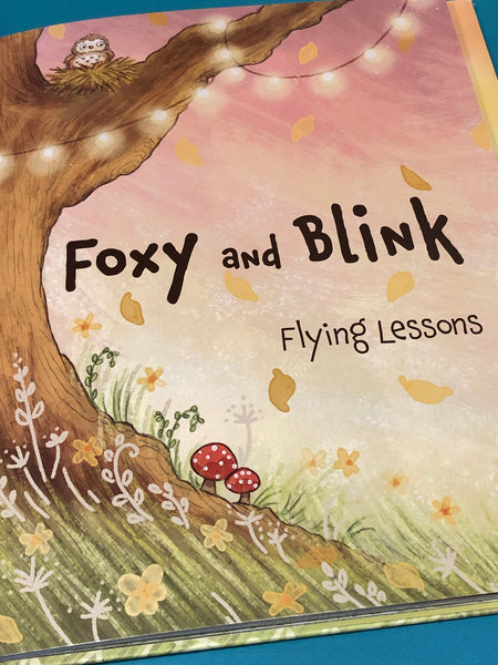 Book cover of 'Foxy and Blink Flying Lessons' with a mushroom illustration and colorful design.