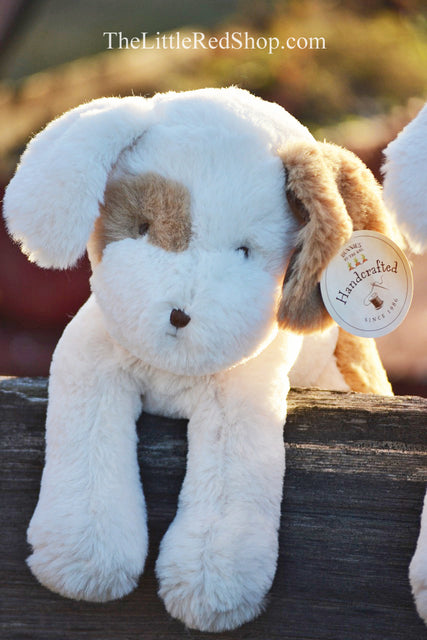 Bunnies by the Bay Little Skipit Puppy Dog Stuffed Animal sitting on a split rail fence in the sunshine at The Little Red Shop