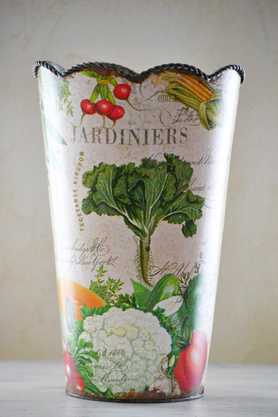 Decorative vase with garden-themed design on a plain background