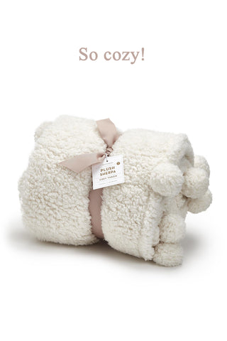 Two's Company Cream Sherpa Pom Pom Throw Blanket Rolled with Ribbon & Tag View