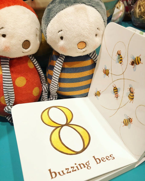 Girlbug & Buzzbee reading Bao Bao 123 Board Book