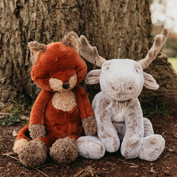 Great Big Foxy & Bruce the Moose Stuffed Animals in front of tree