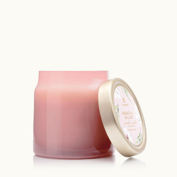 Close up of Thymes Magnolia Willow Pink Jar Statement Candle with brushed gold lid